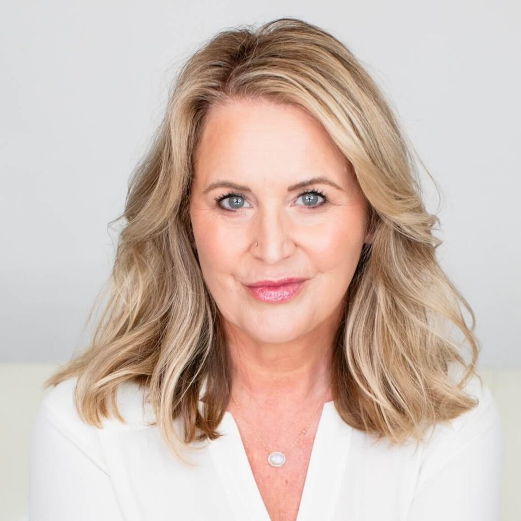 Kate Anthony, high conflict divorce coach, looking into the camera.
